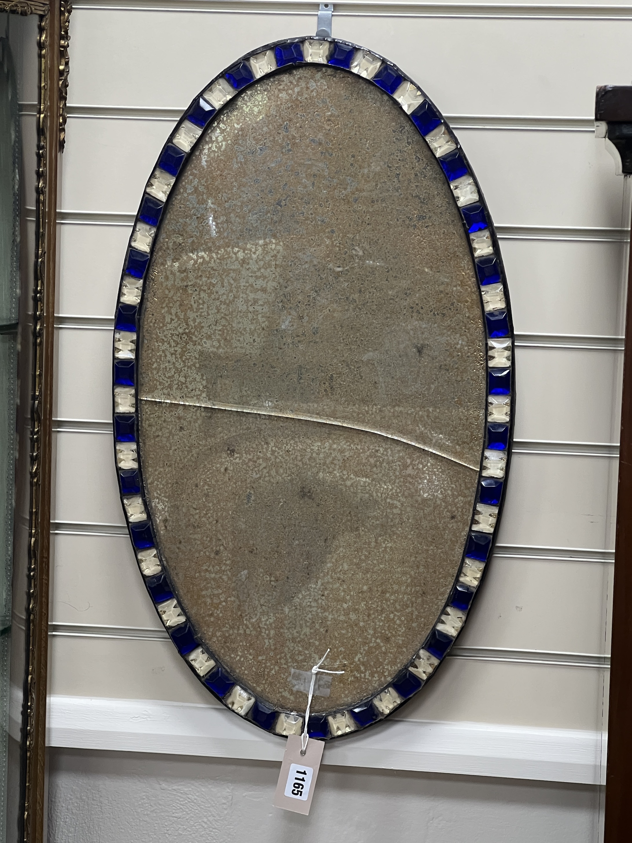 An Irish style oval wall mirror, width 38cm, height 66cm